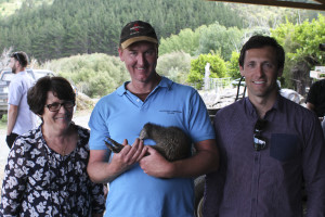 Margaret and Robbie Tindall meet Mabel the kiwi held by Bernie Buhler, Matakohe-Limestone Is Ranger.