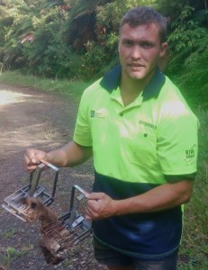 Kiwi Coast Trapper Shaun Gifford with stoat caught at Taheke